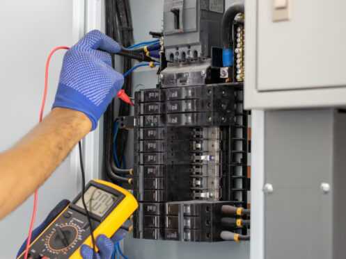 Electrician checking the electric panel at a Beckley home